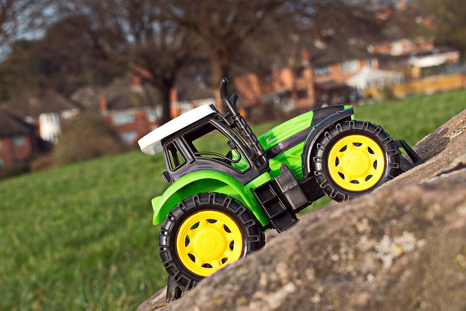 off road, stone, toy, tractor, vehicle, mountains, tires, yellow, grass, transportation