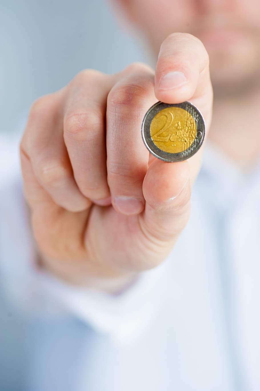 person, holding, round silver-colored coin, coin, coins, money, savings, a wealth of, rich, glossy