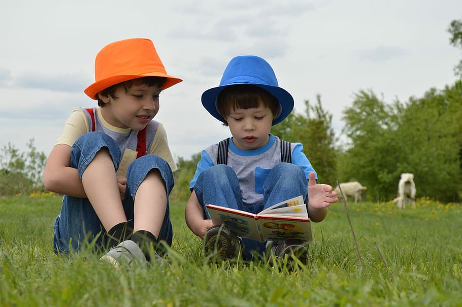 kid reading, book, boy, sitting, grass field, outdoor, boys, meadow, kids, hats