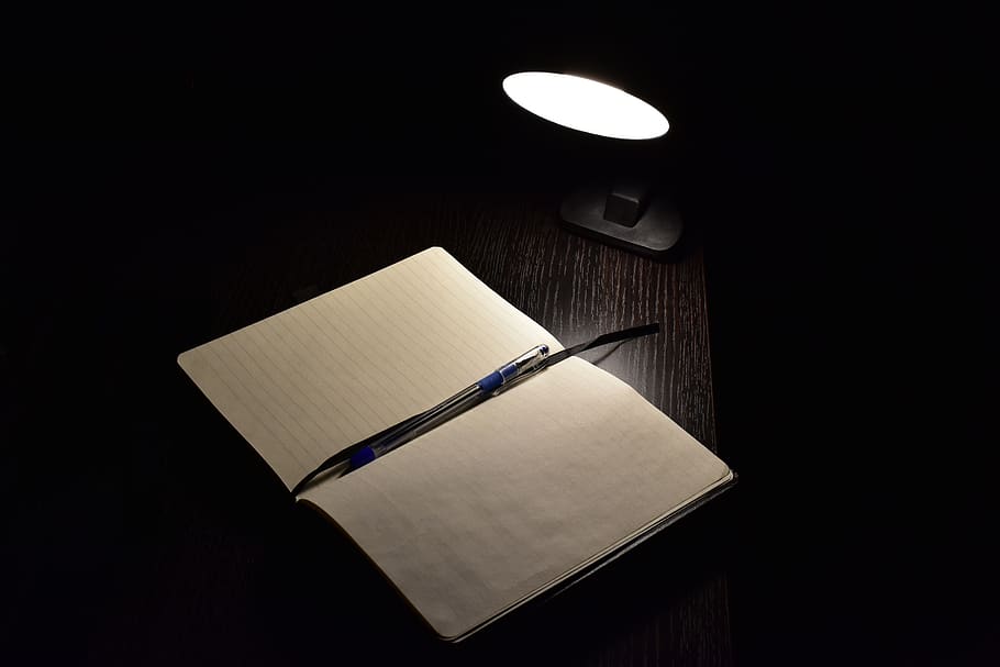 darkness, study, pen, publication, book, indoors, black background, copy space, paper, wood - material