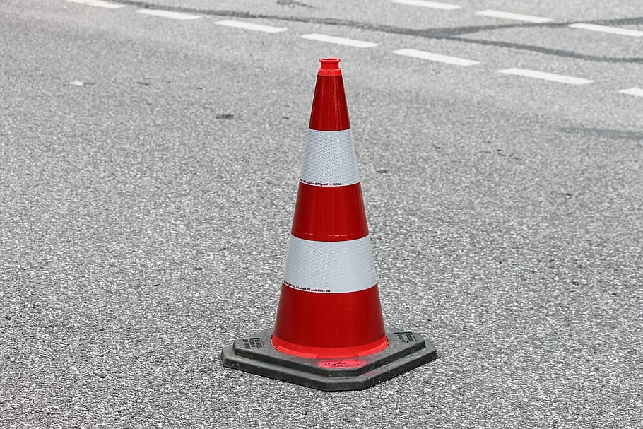 pylon, traffic cone, barrier, road sign, lock, road, hat, transport facility, roadway, road cover