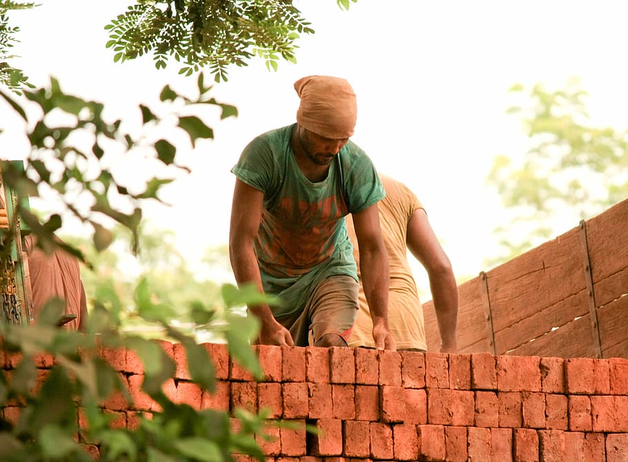 man building brick wall, bricks, labourer, indian, labour, loading, truck, worker, real people, lifestyles
