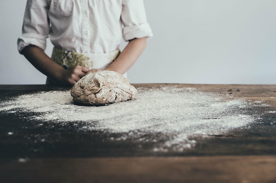 person, wearing, white, dress shirt, facing, flour, table, adult, apron, baking