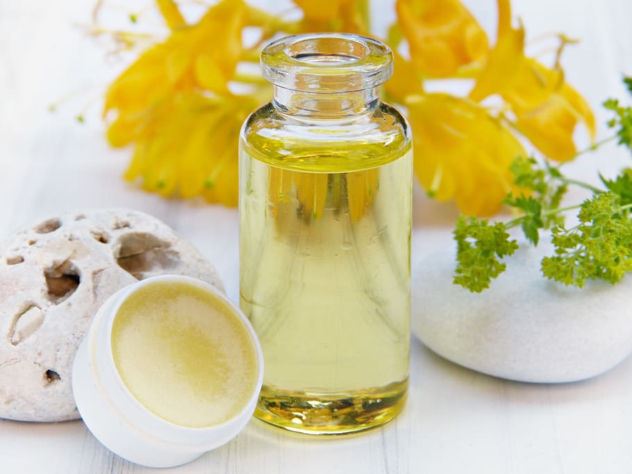 oil, lip balm, beeswax, flowers, bottle, glass, honey, pollen, yellow, cosmetics