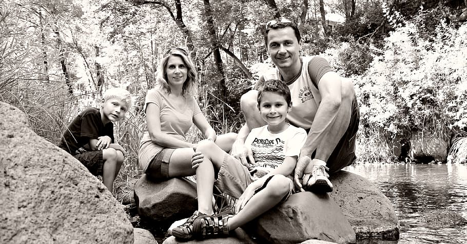 grayscale photo, woman, man, two, boys, water stream, family, vacation, togetherness, happy
