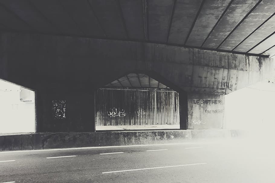 grayscale photography, underground, road, black, white, photography, house, overpass, pavement, graffiti