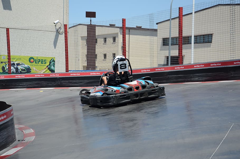 karting, circuit, engine, mode of transportation, transportation, sport, sports race, building exterior, real people, architecture