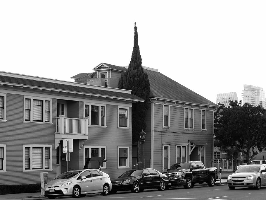 assorted, vehicles, parked, wooden, houses, grayscale, photograph, structure, urban, city
