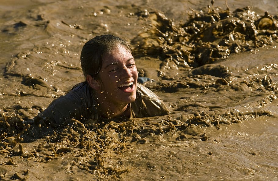 person, submerged, mud, crawl, competition, race, obstacle, feet, water, shoes