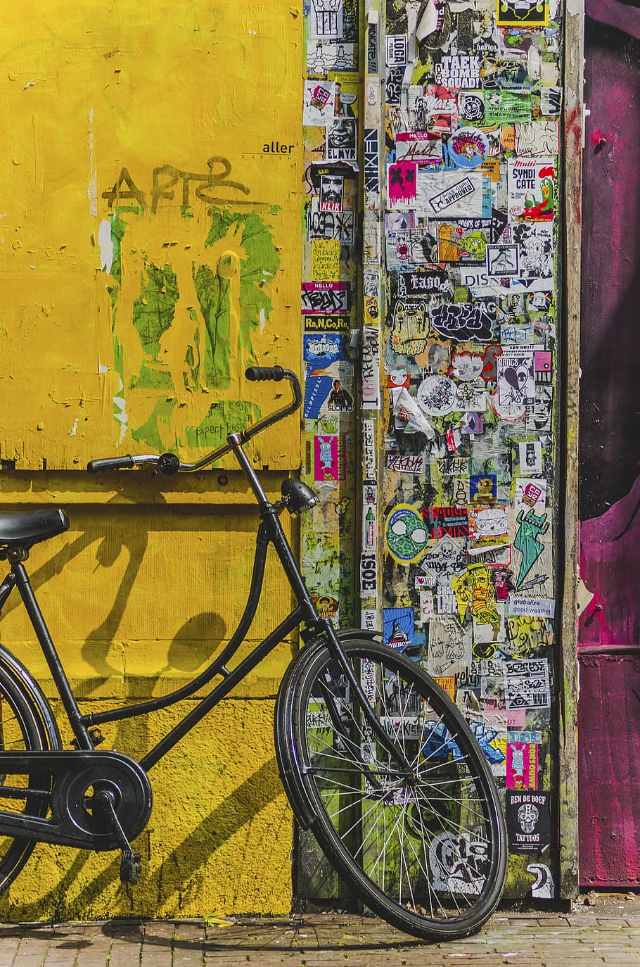 black, cruiser bicycle, parked, door, bicycle, bike, aesthetic, stickers, vandalism, paper