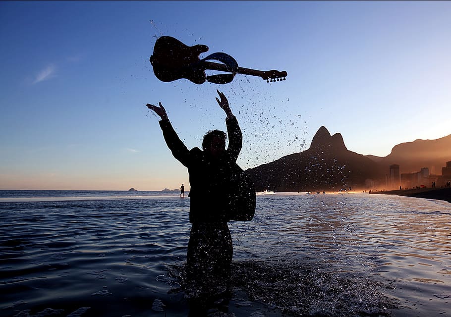 person, water, throwing, guitar, sea, ocean, tossing, silhouettes, silhouette, mountains