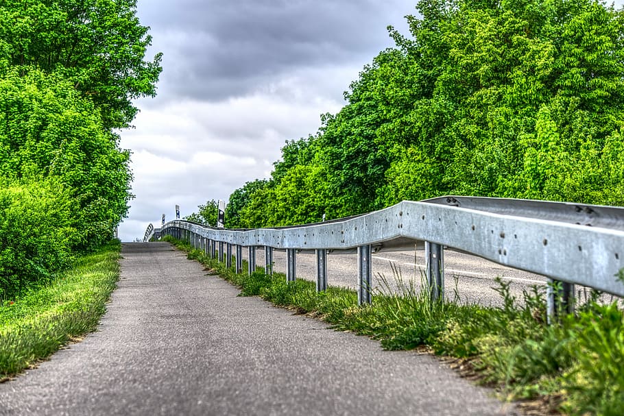 high-saturation photography, gray, pavement road, two, green, trees, nimbus clouds, cycle path, away, road