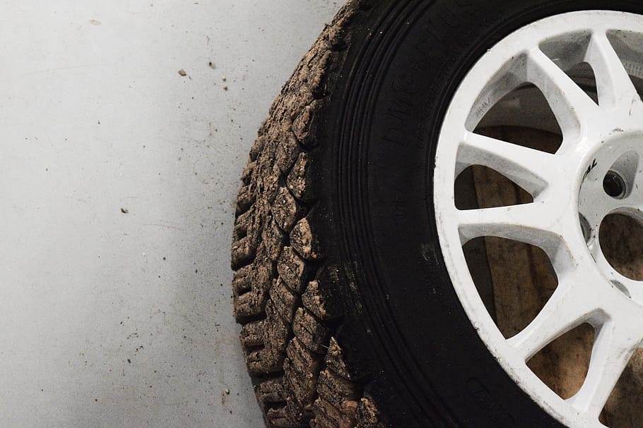 white, multi-spoke vehicle wheel, tire, floor, car, tires, wheel, rubber, tyre, black