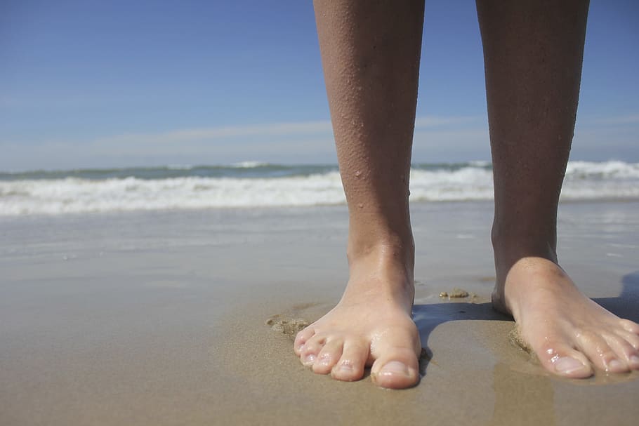 person, standing, seashore, feet, beach, sea, barefoot, low section, human leg, human foot