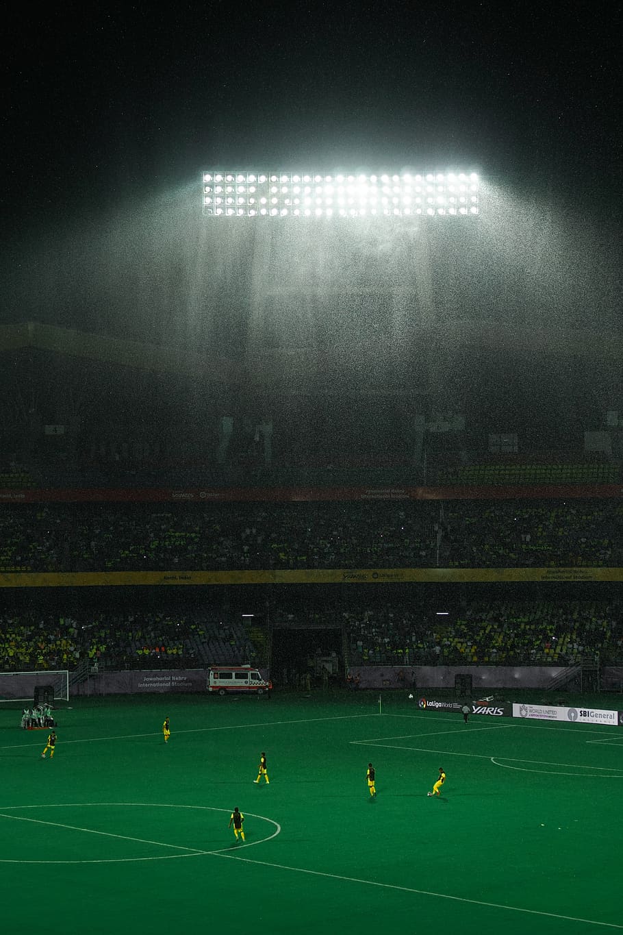 football, rain, stadium, sport, group of people, crowd, soccer, team sport, real people, soccer field