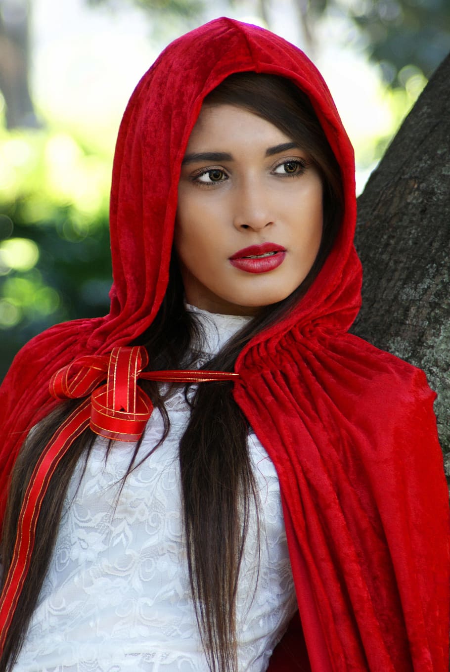 red riding hood, girl, hood, brown eyes, tree, ribbon, red, young adult, one person, portrait