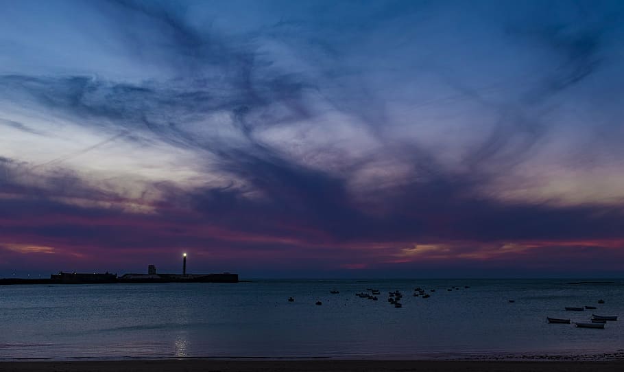 island, lighthouse, light, dusk, body, water, sunset, purple, sky, beach