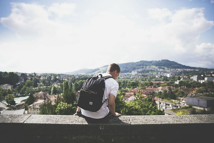 man, white, t-shirt, sitting, concrete, wall, young, guy, people, backpack