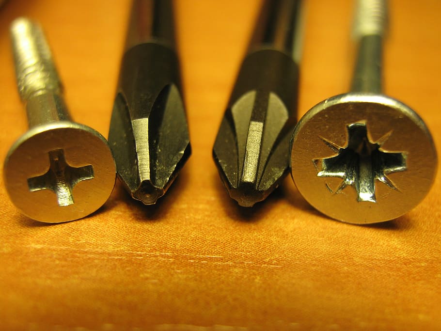 silver drill bits, phillips, screw, screwdrivers, close-up, macro, tools, metal, wood - material, indoors