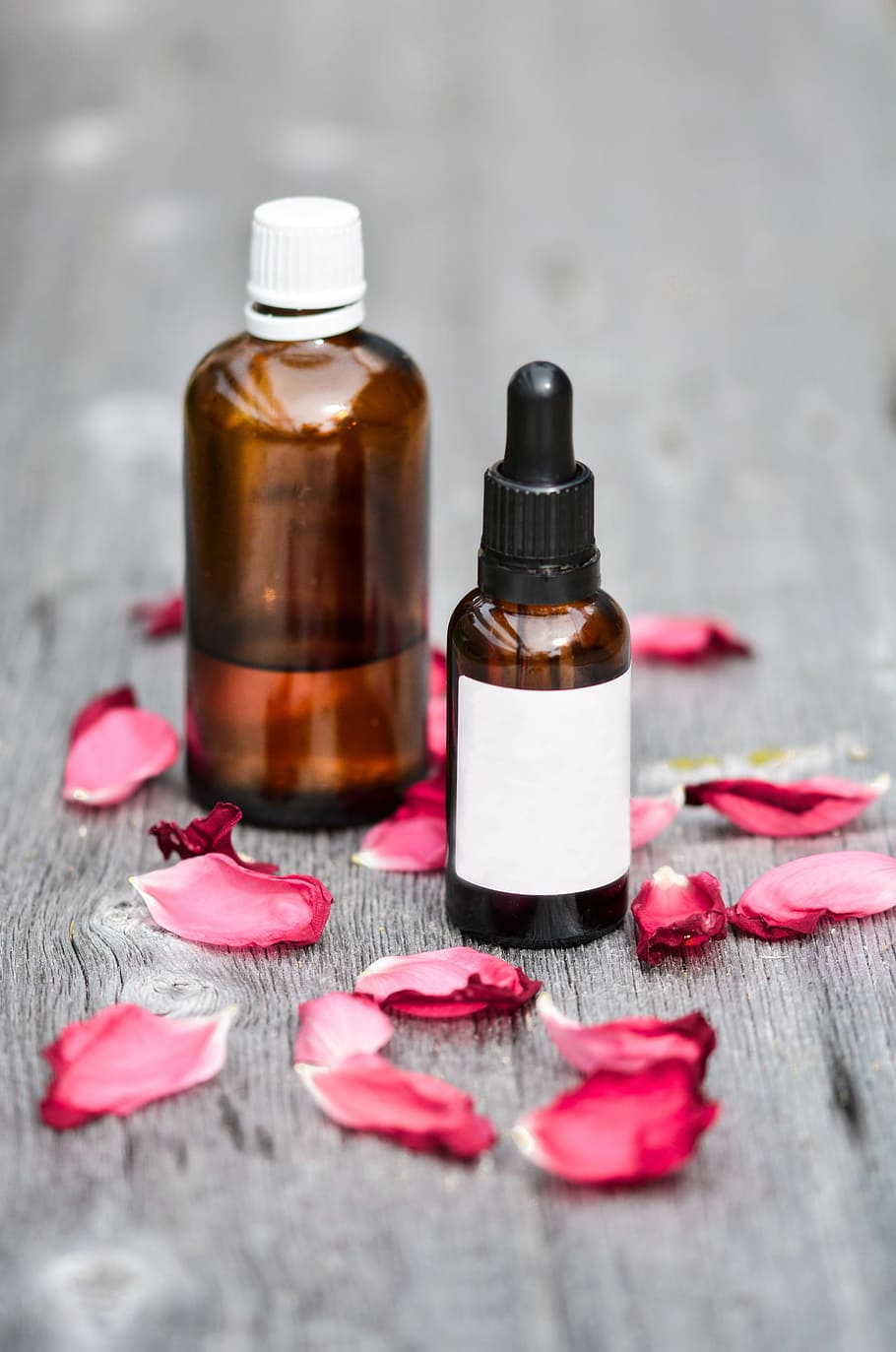 two, amber, glass bottles, red, flower petals, essential oils, alternative, aroma, aromatic, body