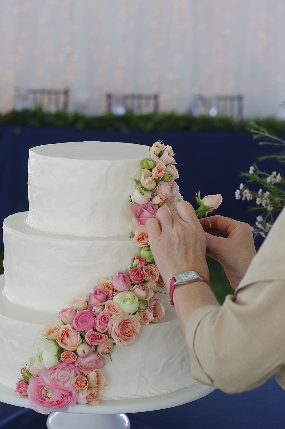 wedding cake, wedding flowers, cake, dessert, icing, flowers, human hand, hand, real people, holding