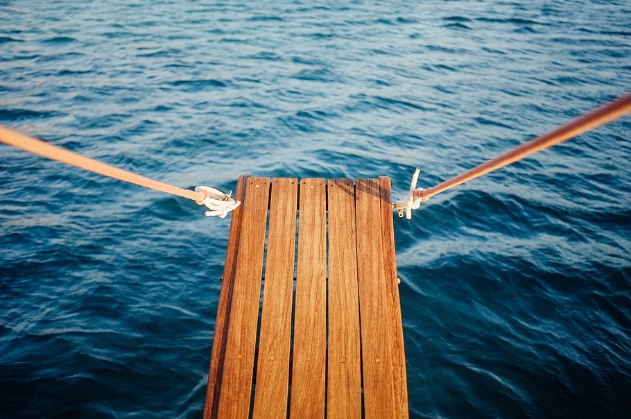 brown, wooden, dock, surrounded, body, water, near, wood, plank, ocean