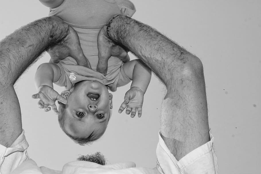 grayscale photo, man, carrying, baby, girl, father, playing, daughter, fun, happy