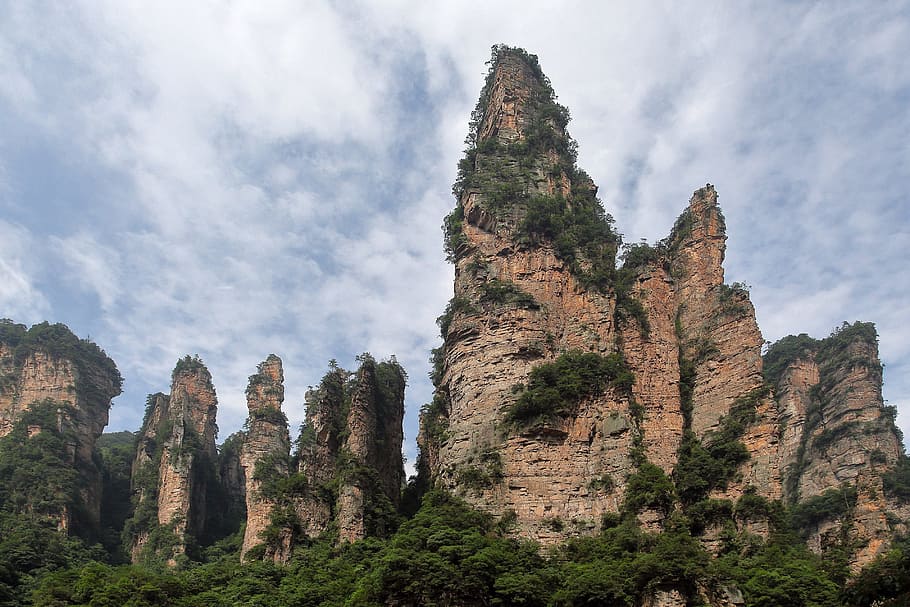 zhangjiajie, wulingyuan, quartz sandstone peak woodland landscape, sky, plant, tree, low angle view, cloud - sky, mountain, nature