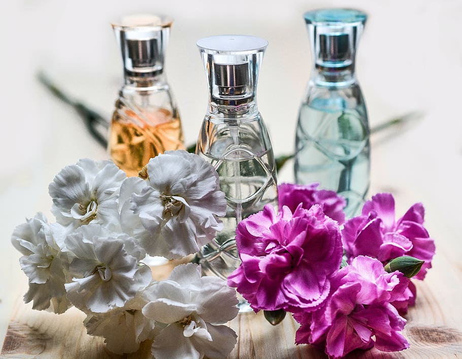 selective, focus photography, three, spray bottles, behind, pink, white, petaled flowers, perfume, bottle