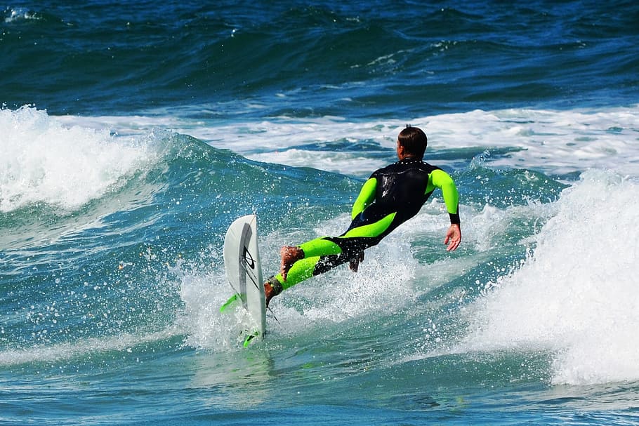 man surfing, daytime, sea, water, beach, surf, sport, leisure activity, motion, aquatic sport