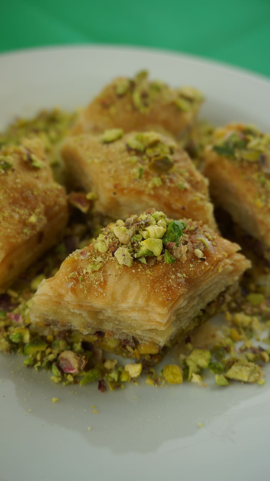 baklava with pistachios, oriental pastries, sweet pastries, ready-to-eat, food, food and drink, close-up, plate, freshness, indoors