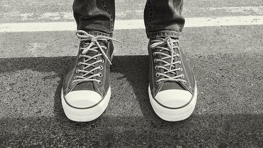 grayscale photo, person, wearing, low-top shoes, converse, sneakers, chucks, fashion, shoe, outdoors