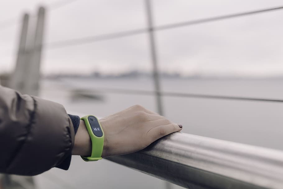 person, holding, hand rail, green, band, exercise, tracker, fitness, health, fitbit
