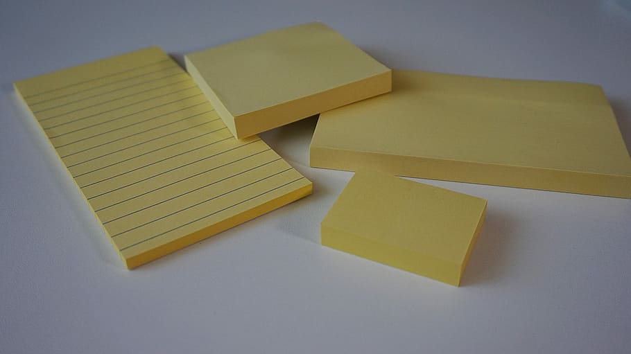 postit, sticky notes, adhesive note, office accessories, memo pad, yellow, indoors, high angle view, paper, still life
