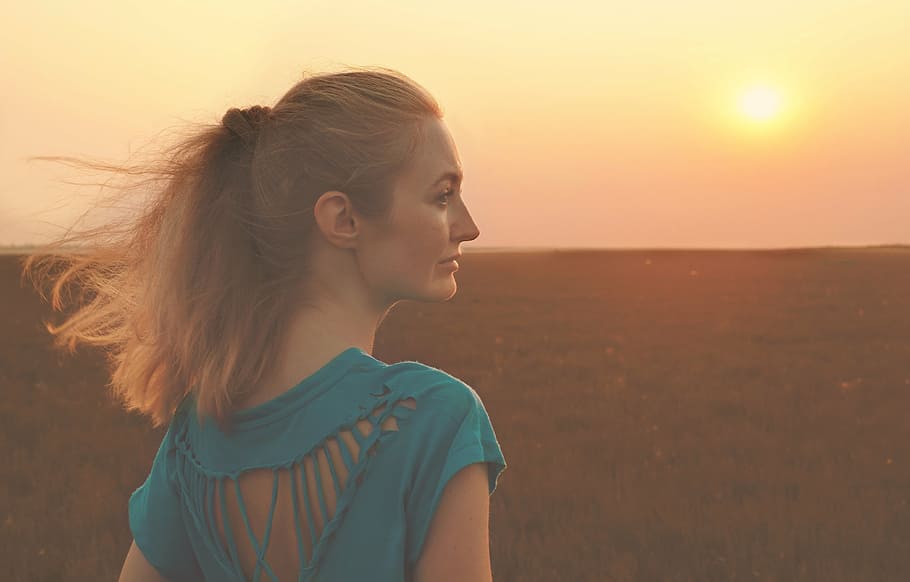 woman, wearing, blue, crew-neck shirt, standing, facing, sun, girl, sunset, sunrise
