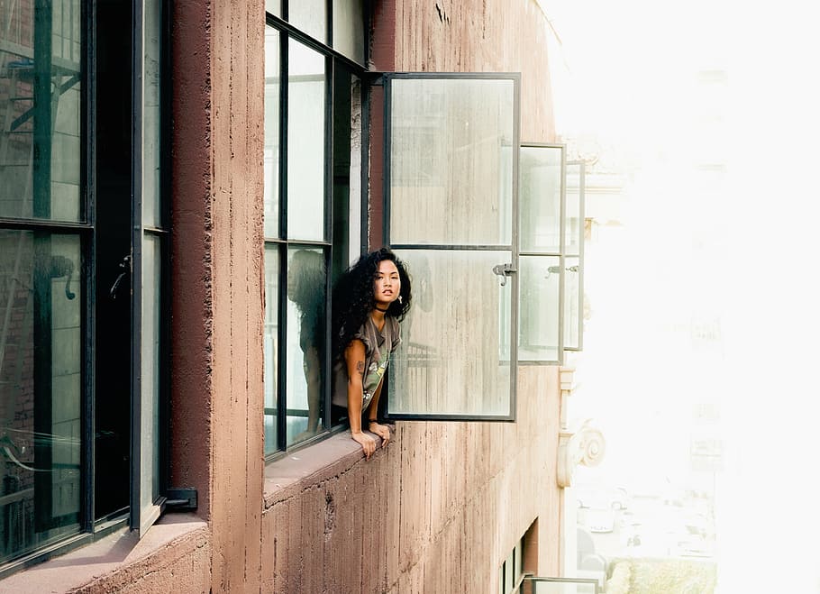 woman, looking, window, daytime, building, apartment, windows, people, girl, lady
