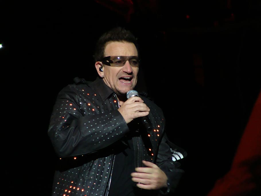 man, holding, microphone, wearing, black, leather jacket, performing, stage, paul david hewson, singer