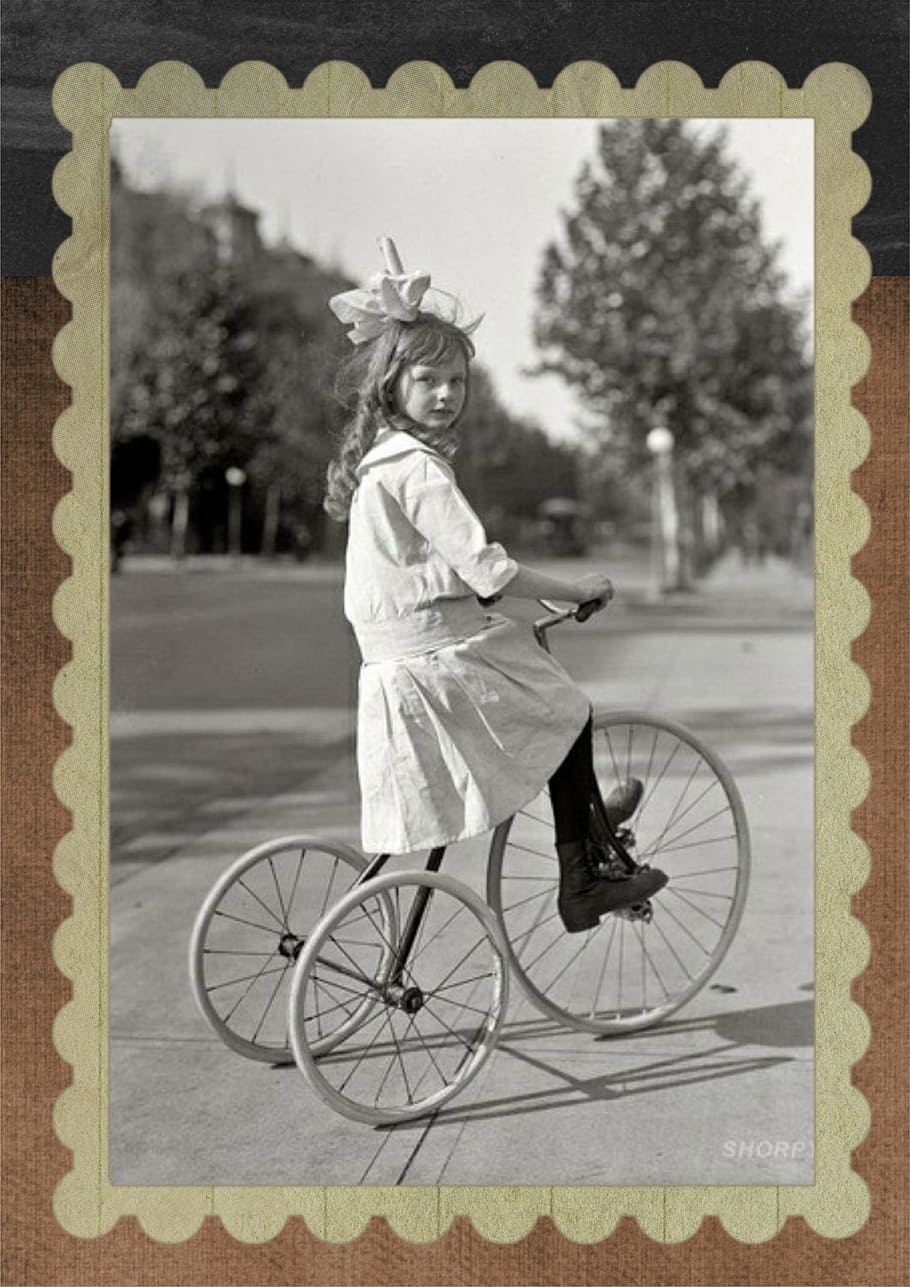 grayscale photo, girl, riding, bicycle, vintage, tricycle, transportation, portrait, outdoors, ride