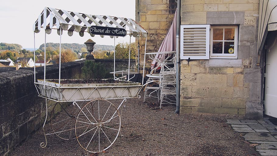 white, multicolored, metal stall, daytime, cart, near, gray, wall, chariot, vintage
