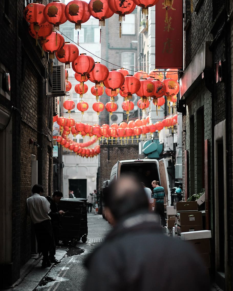 people, standing, red, chinese lanterns, high-rise, building, daytime, architecture, infrastructure, street