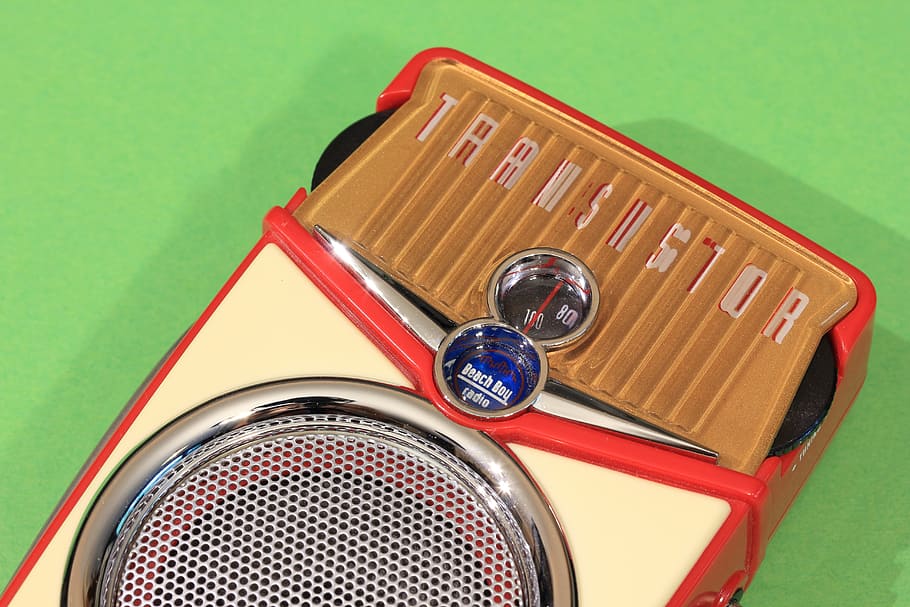 transistor, radio, receiver, portable, pocket, beach boy, retro, close-up, indoors, colored background