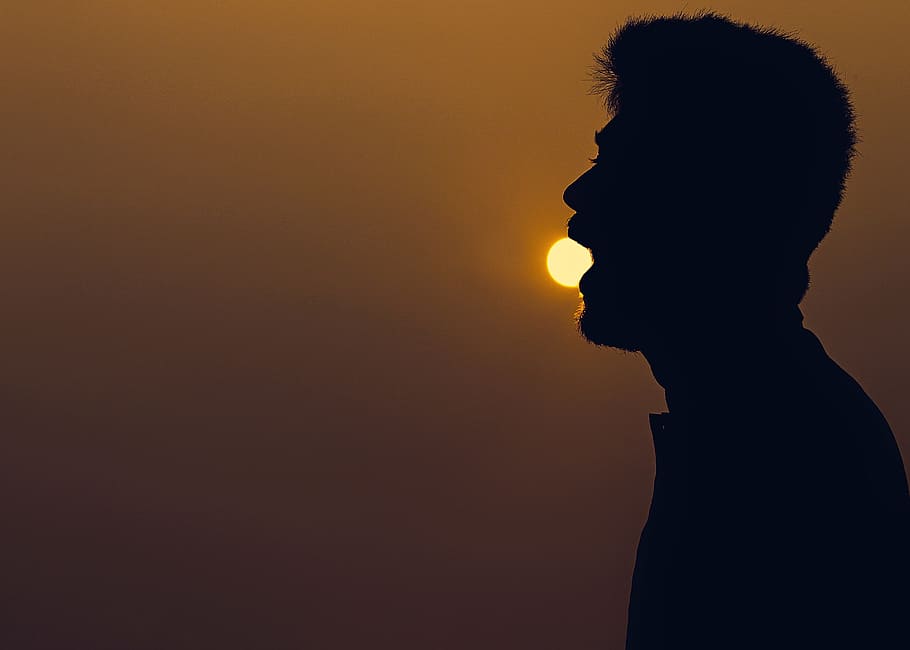 sunset, boy, eating, sky, gradient sky, silhouette, one person, copy space, side view, portrait