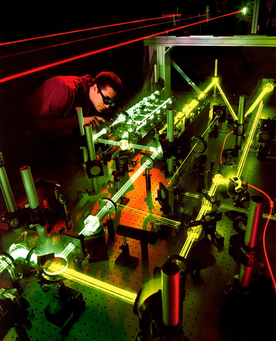 man, holding, tool, gray, metal frame, laser, laser experiment, light beam, light, science