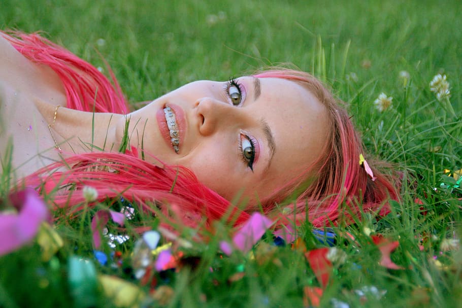 girl, pink hair, grass, confetti, smile, happiness, women, outdoors, lying Down, summer