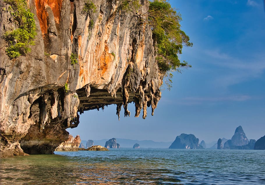 rock, thailand, stalactite, sea, water, rock formation, beauty in nature, rock - object, tranquility, scenics - nature