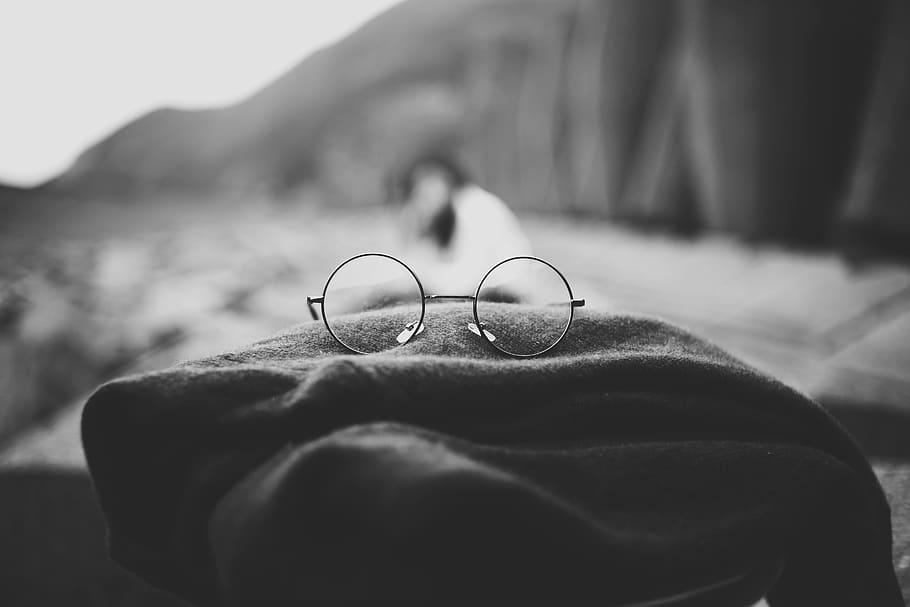 cloth, blur, black and white, eyeglasses, eyewear, glasses, close-up, focus on foreground, human body part, day