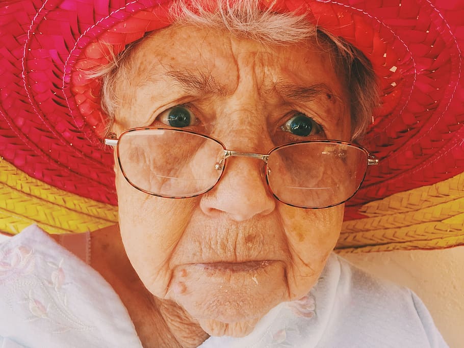 woman, wearing, red, yellow, woven, hat, women's, old woman, glasses, looking