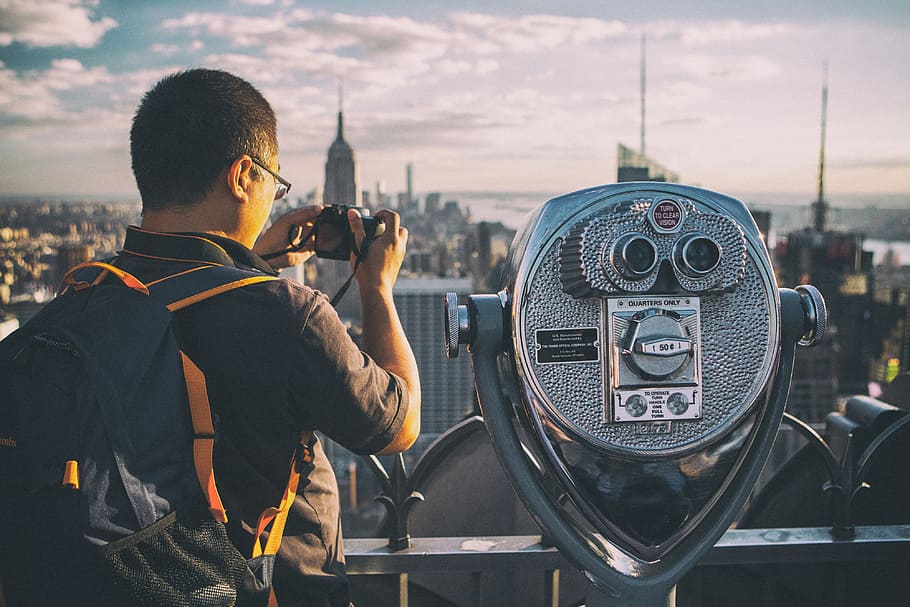 tourist, takes, camera, top, rock observation deck, famous, manhattan, new, york city, Top Of The Rock