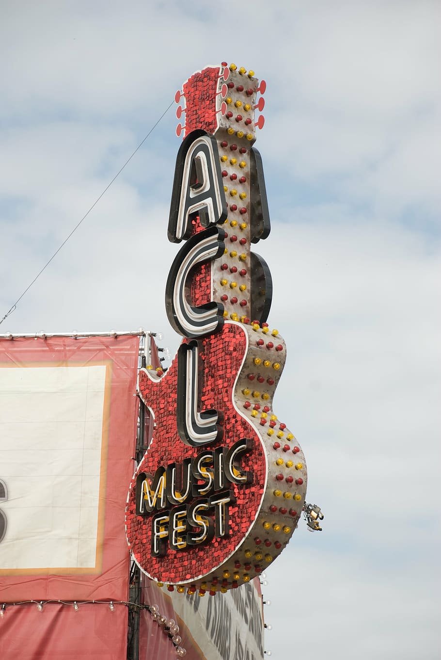 red, white, yellow, acl, music, fest, guitar, signage, blue, cloudy