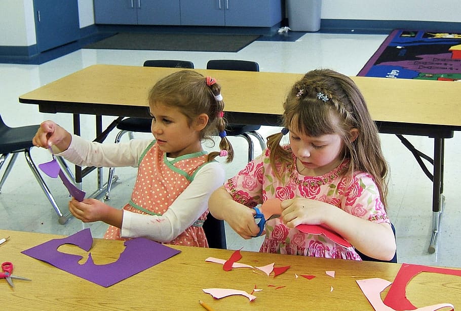 two, girls, cutting, purple, papers, front, brown, table, classroom, kindergarten